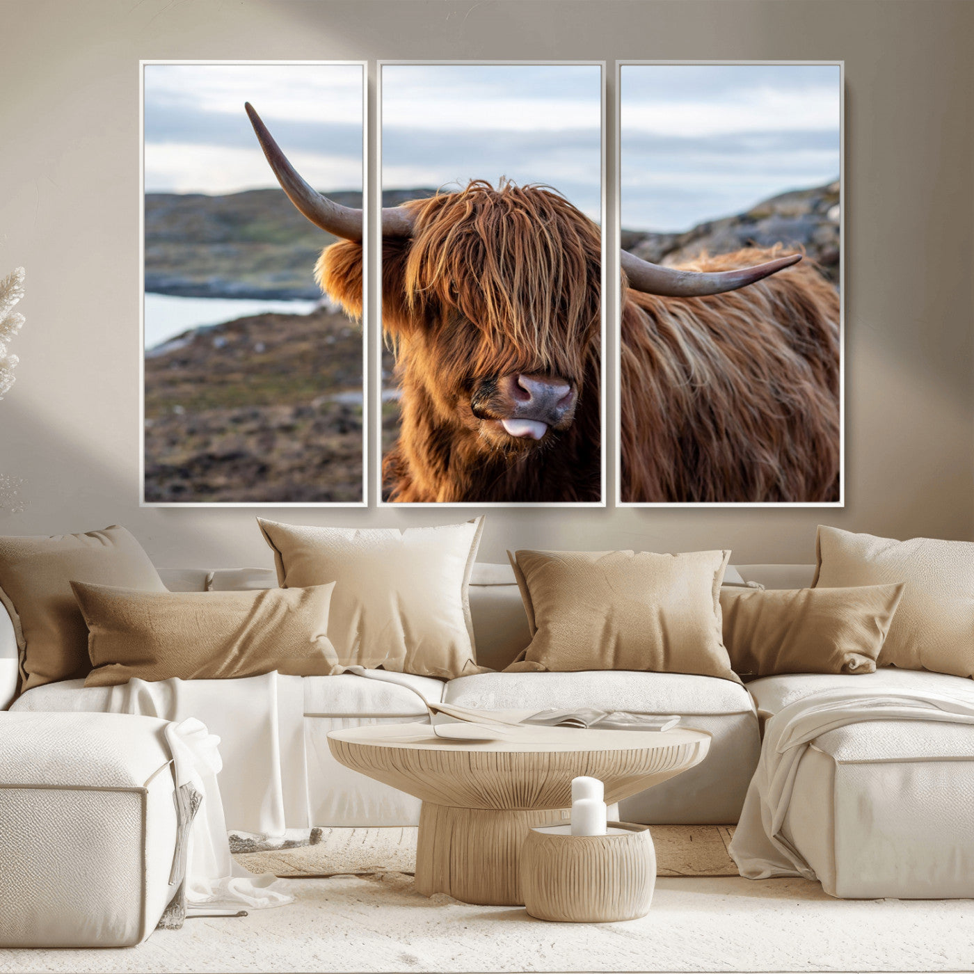 71222-MGV-CV-36X24-A playful Highland cow with shaggy fur sticks out its tongue, set against a rugged landscape — perfect for quirky home or office