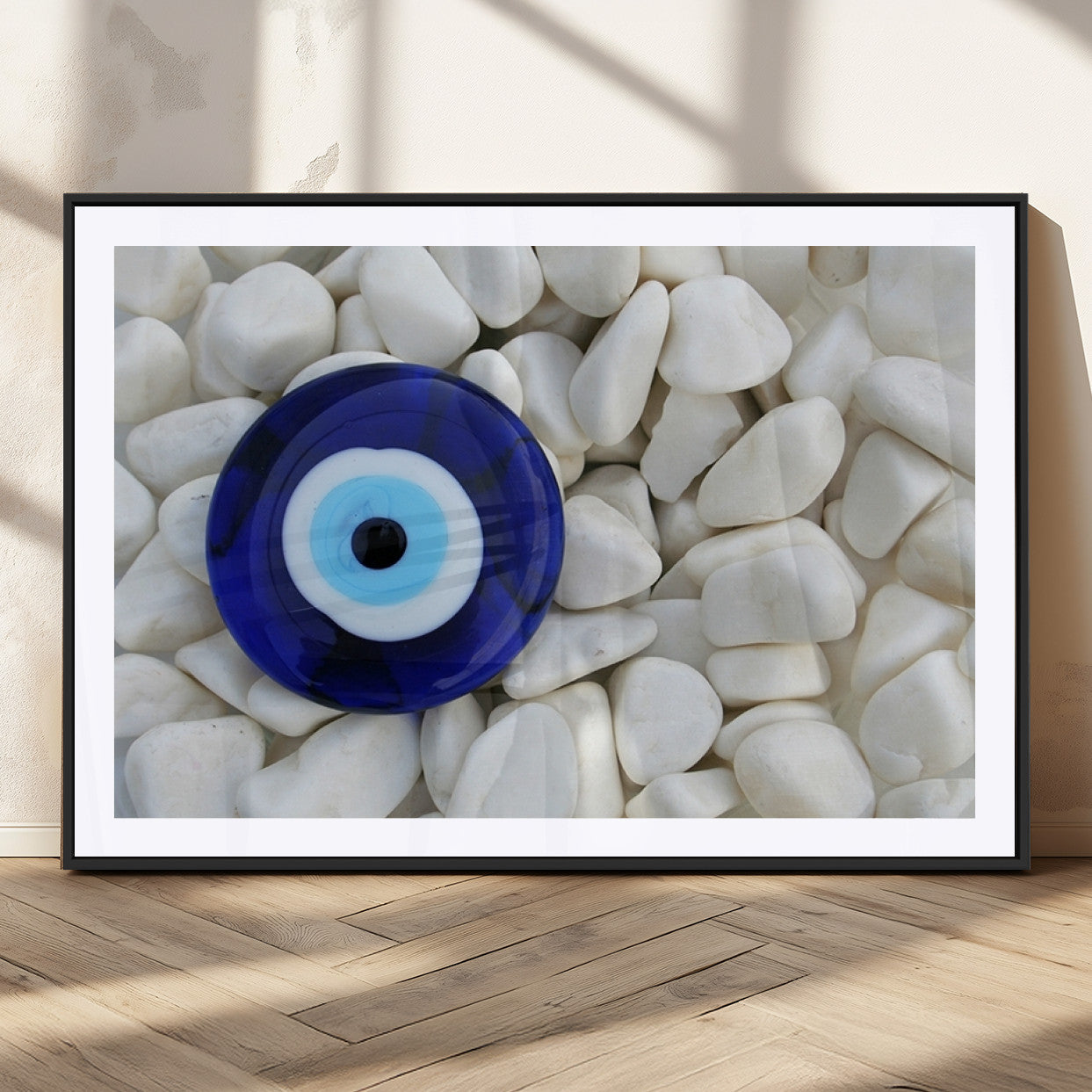 48883-MGC-FP-36x24_Black-Evil Eye Wall Art – Deep Blue Symbol of Presence and Calm on White Stones, Subtle Spiritual Decor for Entryway, Studio, Office or