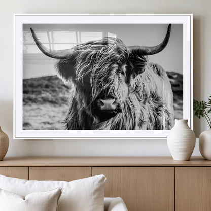 36979-MGV-CV-36X24-Striking black-and-white portrait of a Highland cow with flowing fur and majestic horns, perfect for rustic and elegant home or