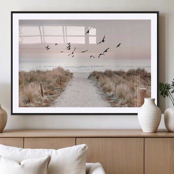 34632598-MGC-FP-36x24_Black-Beach Pathway Wall Art – Coastal Canvas Print with Sandy Trail, Flying Birds and Pastel Sky, Serene Ocean Landscape Photography