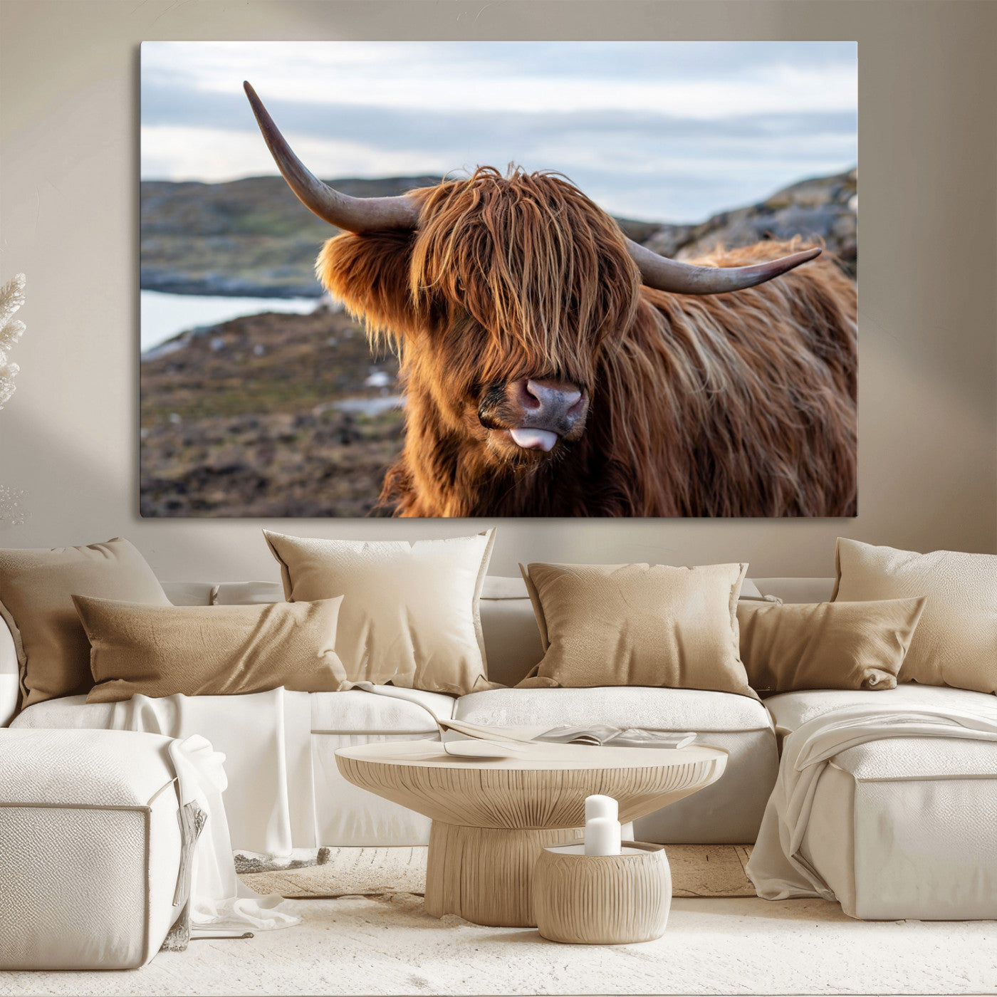 71222-MGV-CV-36X24-A playful Highland cow with shaggy fur sticks out its tongue, set against a rugged landscape — perfect for quirky home or office