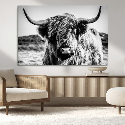 36979-MGV-CV-36X24-Striking black-and-white portrait of a Highland cow with flowing fur and majestic horns, perfect for rustic and elegant home or