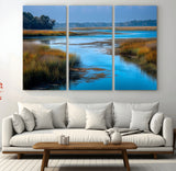 26300004-MGV-CV-48X32-3P-Tranquil Marshland Canvas Wall Art – Blue Water, Reflective Sky, Golden Grasses, Calm Nature Landscape, Scenic Outdoor Beauty for