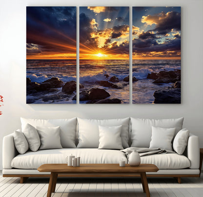 35900590-MGV-CV-48X32-3P-Sunset Ocean Waves Canvas Wall Art – Rocky Shore, Dramatic Sky, Golden Sun Rays, Coastal Beauty, Serene Water Motion for Living