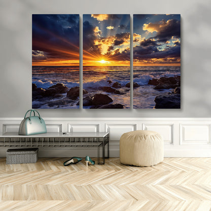 35900590-MGV-CV-48X32-3P-Ocean Sunset Wall Art – Vivid Seascape Canvas Print with Sunburst Sky, Crashing Waves and Rocky Shore, Dramatic Coastal