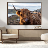 71222-MGV-FC-36X24_Walnut-A playful Highland cow with shaggy fur sticks out its tongue, set against a rugged landscape — perfect for quirky home or office