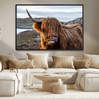 71222-MGV-CV-36X24-A playful Highland cow with shaggy fur sticks out its tongue, set against a rugged landscape — perfect for quirky home or office