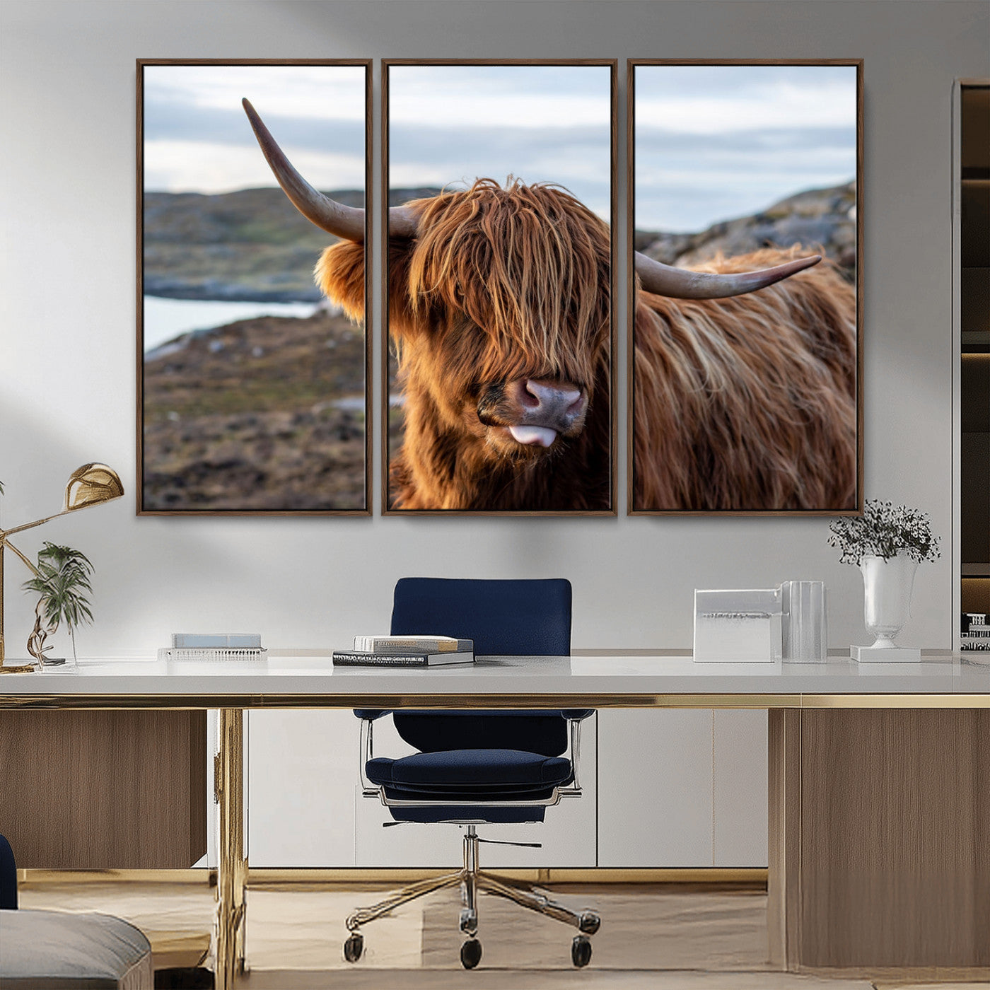 71222-MGV-CV-36X24-A playful Highland cow with shaggy fur sticks out its tongue, set against a rugged landscape — perfect for quirky home or office