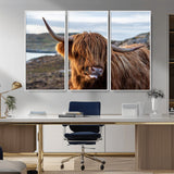 71222-MGV-FC-48X32-3P_White-A playful Highland cow with shaggy fur sticks out its tongue, set against a rugged landscape — perfect for quirky home or office
