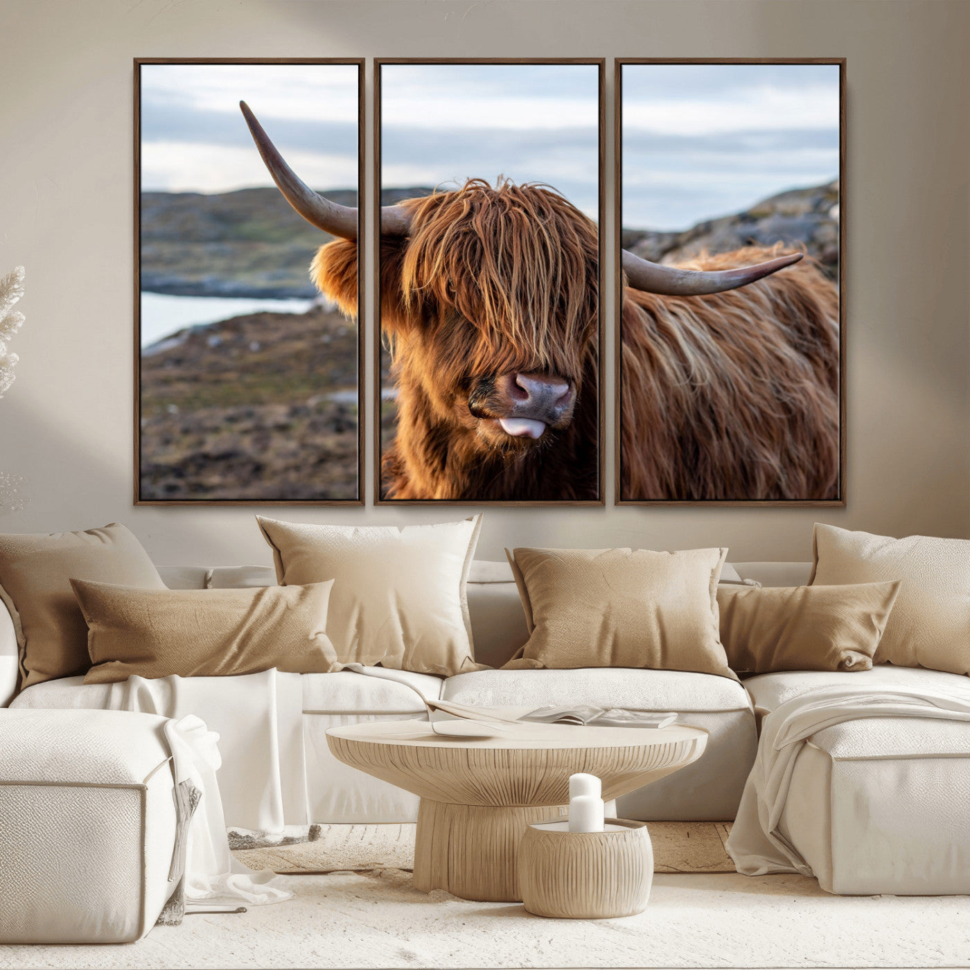 71222-MGV-CV-36X24-A playful Highland cow with shaggy fur sticks out its tongue, set against a rugged landscape — perfect for quirky home or office