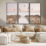 34632598-MGV-FC-48X32-3P_Black-Beach Pathway Wall Art – Coastal Canvas Print with Sandy Trail, Flying Birds and Pastel Sky, Serene Ocean Landscape Photography