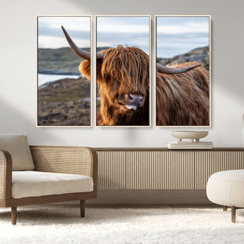71222-MGV-CV-36X24-A playful Highland cow with shaggy fur sticks out its tongue, set against a rugged landscape — perfect for quirky home or office