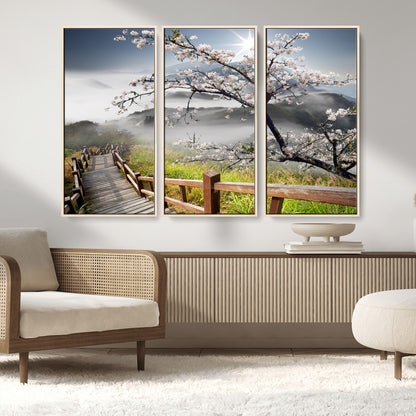 34632598CRY-MGV-FC-48X32-3P_Natural-Cherry Blossom Wall Art – Scenic Asian Landscape Canvas Print with Wooden Walkway, Misty Mountains and Sunrise, Serene Nature
