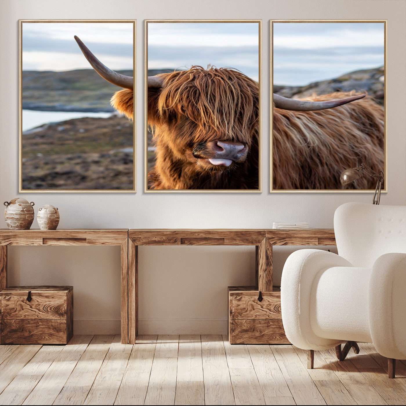 71222-MGV-FC-60X30-3P_Natural-A playful Highland cow with shaggy fur sticks out its tongue, set against a rugged landscape — perfect for quirky home or office