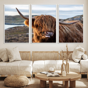 71222-MGV-CV-36X24-A playful Highland cow with shaggy fur sticks out its tongue, set against a rugged landscape — perfect for quirky home or office