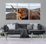 71222-MGV-FC-60X30-3P_White-A playful Highland cow with shaggy fur sticks out its tongue, set against a rugged landscape — perfect for quirky home or office