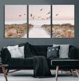 34632598-MGV-CV-36X24-Beach Pathway Wall Art – Coastal Canvas Print with Sandy Trail, Flying Birds and Pastel Sky, Serene Ocean Landscape Photography