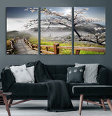 34632598CRY-MGV-CV-60X30-3P-Cherry Blossom Wall Art – Scenic Asian Landscape Canvas Print with Wooden Walkway, Misty Mountains and Sunrise, Serene Nature