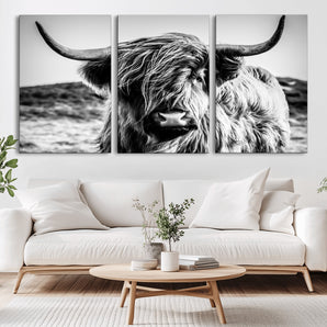 36979-MGV-CV-36X24-Striking black-and-white portrait of a Highland cow with flowing fur and majestic horns, perfect for rustic and elegant home or