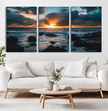 66040852-MGV-CV-60X30-3P-Ocean Sunset Canvas Wall Art – Rocky Shore Waves, Dramatic Clouds, Golden Sun Rays, Coastal Nature, Serene Water Reflection for