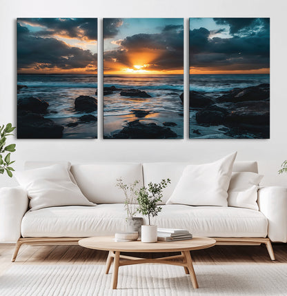 66040852-MGV-CV-60X30-3P-Ocean Sunset Canvas Wall Art – Rocky Shore Waves, Dramatic Clouds, Golden Sun Rays, Coastal Nature, Serene Water Reflection for