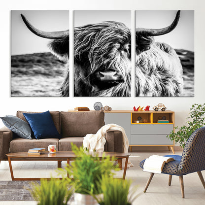 36979-MGV-CV-36X24-Striking black-and-white portrait of a Highland cow with flowing fur and majestic horns, perfect for rustic and elegant home or